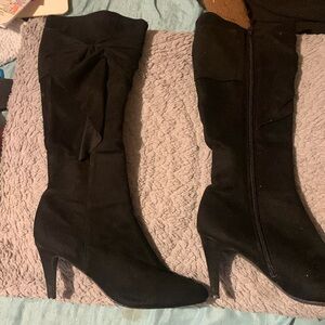 All black winter heeled boots with bow. Brand name: Impo Stretch. Size: 7 1/2.